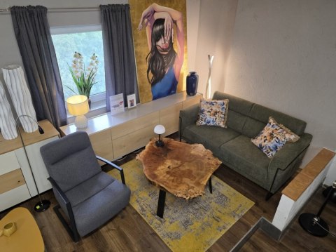 Nowoczesna sofa 2-osobowa FISKARDO XOOON, zielona tkanina pleciona, czarna metalowa rama Nowoczesna sofa 2-osobowa FISKARDO XOOON, zielona tkanina pleciona, czarna metalowa rama
